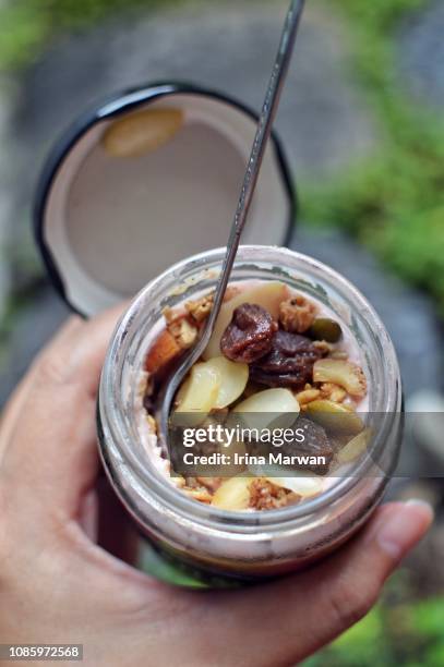 overnight oats in a jar - yoghurt lid stock pictures, royalty-free photos & images