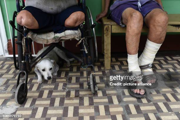 September 2018, Brazil, Rio de Janeiro: Leprosy patients sit in a corridor of the Curupaiti hospital. Even if the disease is curable today, those...