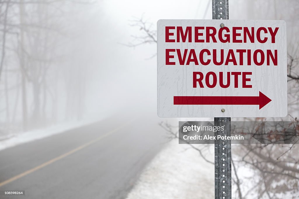 "Emergency evacuation route" sign on the mist road