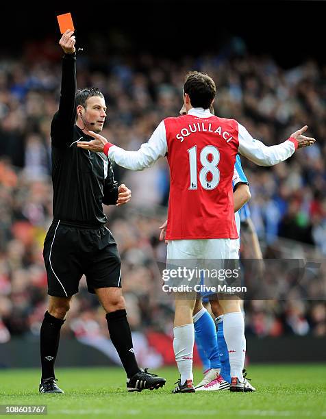 Sebastien Squillaci of Arsenal is shown a straight red card by Referee Mark Clattenburg after his foul on Jack Hunt of Huddersfield during the FA Cup...