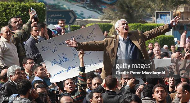 Man gestures as he speaks to protestors in Tahrir Square on January 30, 2011 in Cairo, Egypt. As President Mubarak struggles to regain control after...