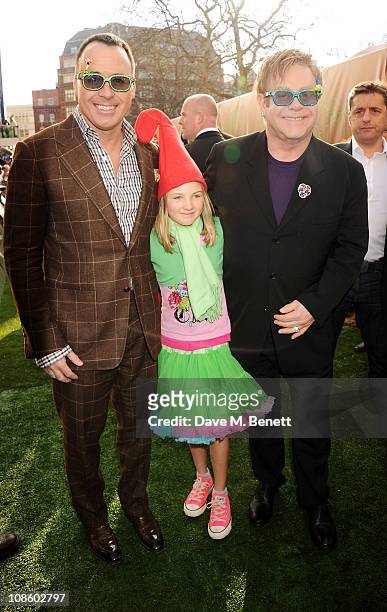 Producer David Furnish, Esme Bertlesen and Executive Producer Sir Elton John attend the UK film premiere of Gnomeo and Juliet at Odeon Leicester...