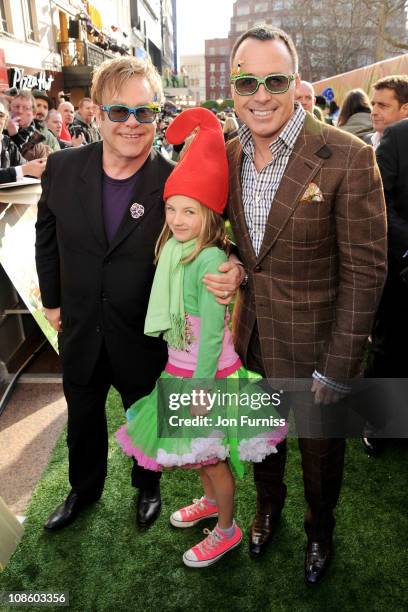 Executive producer Sir Elton John, David Furnish's goddaughter Esmie Bertlesen and producer David Furnish attends the "Gnomeo & Juliet" premiere at...