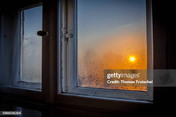 Berlin, Germany Condensation has been reflected on a cold winter morning on an old double box window on January 20, 2019 in Berlin, Germany.