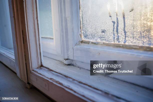 Berlin, Germany Condensation has been reflected on a cold winter morning on an old double box window on January 20, 2019 in Berlin, Germany.