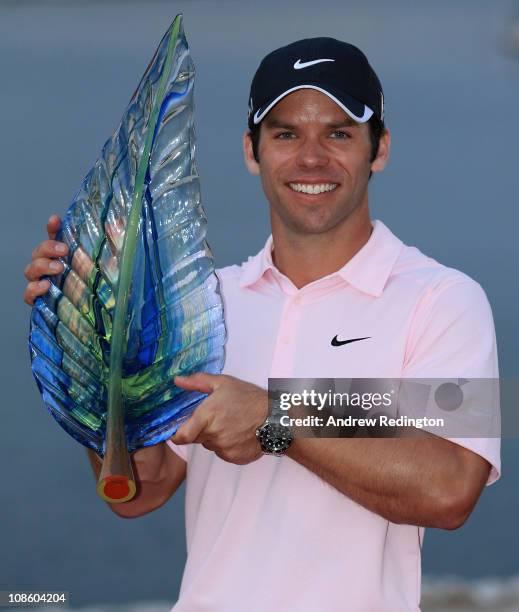 Paul Casey of England poses with the trophy after winning the Volvo Golf Champions at The Royal Golf Club on January 30, 2011 in Bahrain, Bahrain.