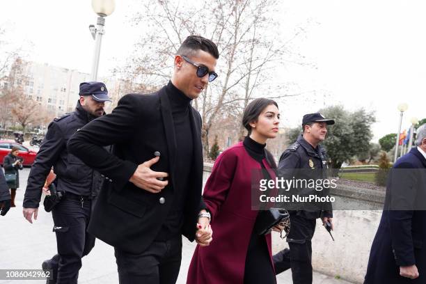 Cristiano Ronaldo with his girlfriend Georgina Rodriguez to attend a court hearing for tax evasion at Audiencia Provincial on January 22, 2019 in...