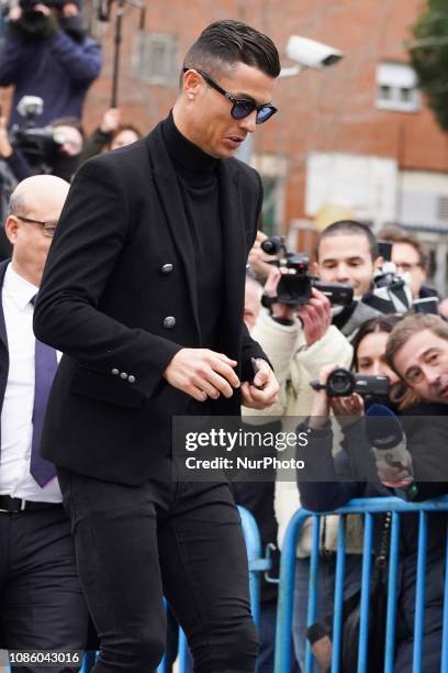 Juventus' forward and former Real Madrid player Cristiano Ronaldo leaves after attending a court hearing for tax evasion in Madrid on January 22,...