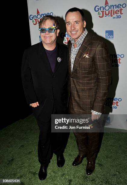 Executive producer Sir Elton John and producer David Furnish attend the "Gnomeo & Juliet" premiere at Odeon Leicester Square on January 30, 2011 in...