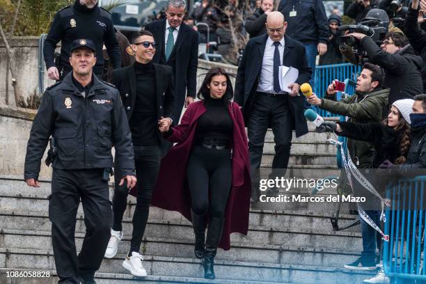 Portuguese football player Cristiano Ronaldo leaves 'Audiencia provincial' court with his girlfriend Georgina Rodriguez after tax evasion trial.