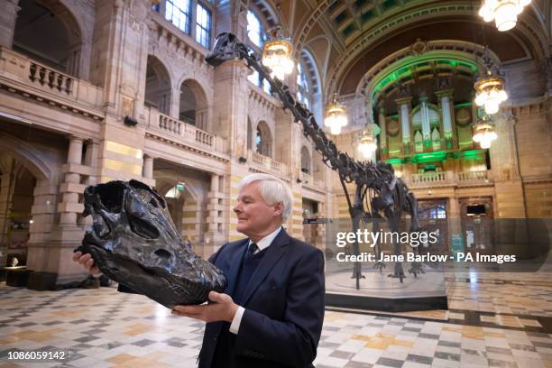 William Thomson, great grandson of the Scottish-American philanthropist Andrew Carnegie, takes a closer look at a plastic replica of the skull of...