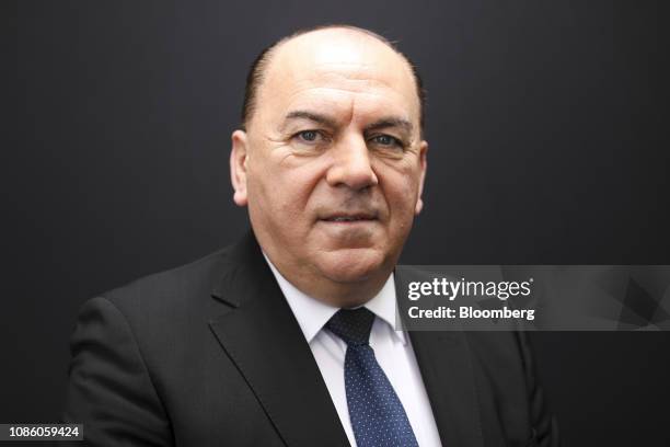 Axel Weber, chairman of UBS Group AG, poses for a photograph following a Bloomberg Television interview on the opening day of the World Economic...