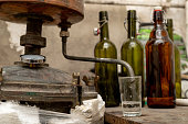 Alcohol production in home conditions. Accessories for the production of homemade moonshine. Place - home basement.