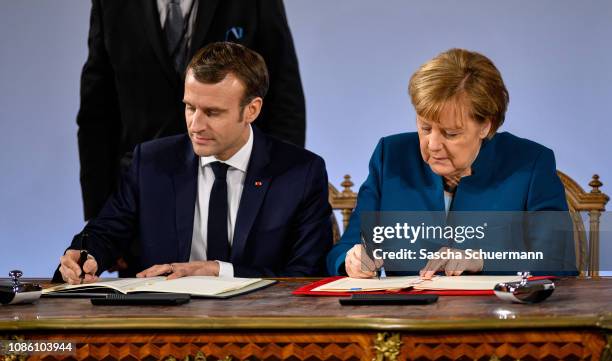 German Chancellor Angela Merkel and French President Emmanuel Macron sign the Aachen Treaty on January 22, 2019 in Aachen, Germany. The treaty is...