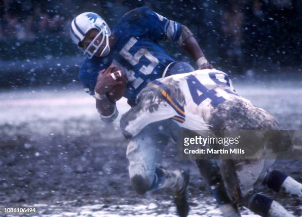 Bobby Williams of the Detroit Lions gets tackled by Dale Hackbart of the Minnesota Vikings during an NFL game on November 27, 1969 at Tiger Stadium...