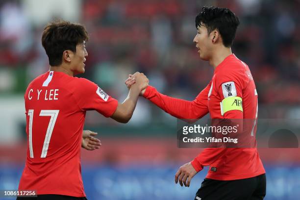 Son Heung-Min of South Korea celebrate with his teammate Lee Chung-Yong after South Korea scoring the opening goal during the AFC Asian Cup round of...