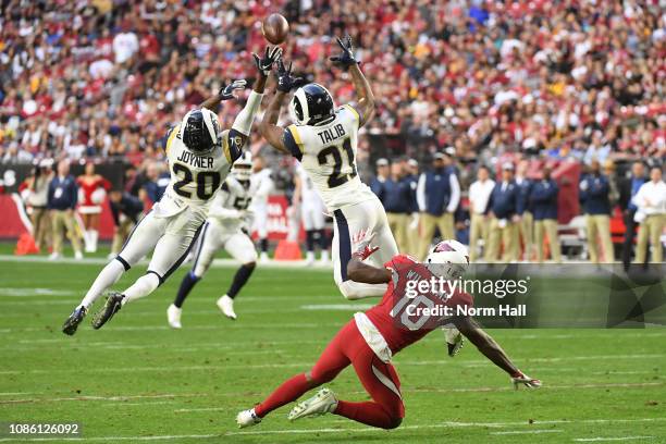 Lamarcus Joyner and Aqib Talib of the Los Angeles Rams break up a pass intended for Chad Williams of the Arizona Cardinals in the second half of the...