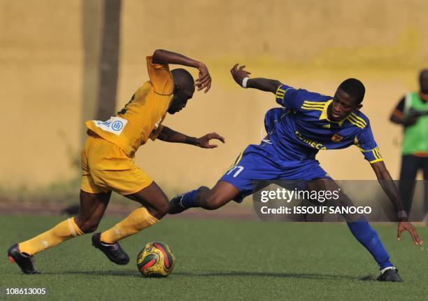 Asec Abidjan player Bakary Kone vies with Asc Snim Cansado of Mauritania player Mohamed on January 30, 2011 at the Robert Champroux stadium in...
