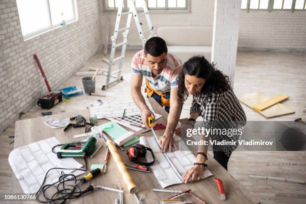 couple making home improvement and measuring - residential extensions stock pictures, royalty-free photos & images