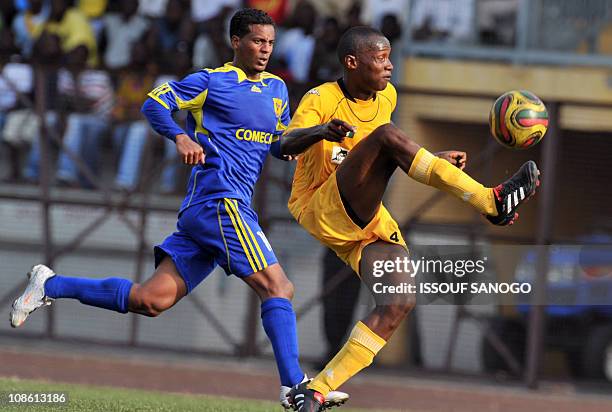 Asec d'Abidjan player Diomande Ahmed duels for the ball with Asc Snim Cansado of Mauritania player Mohamed Yahya Ali on January 30, 2011 at the...