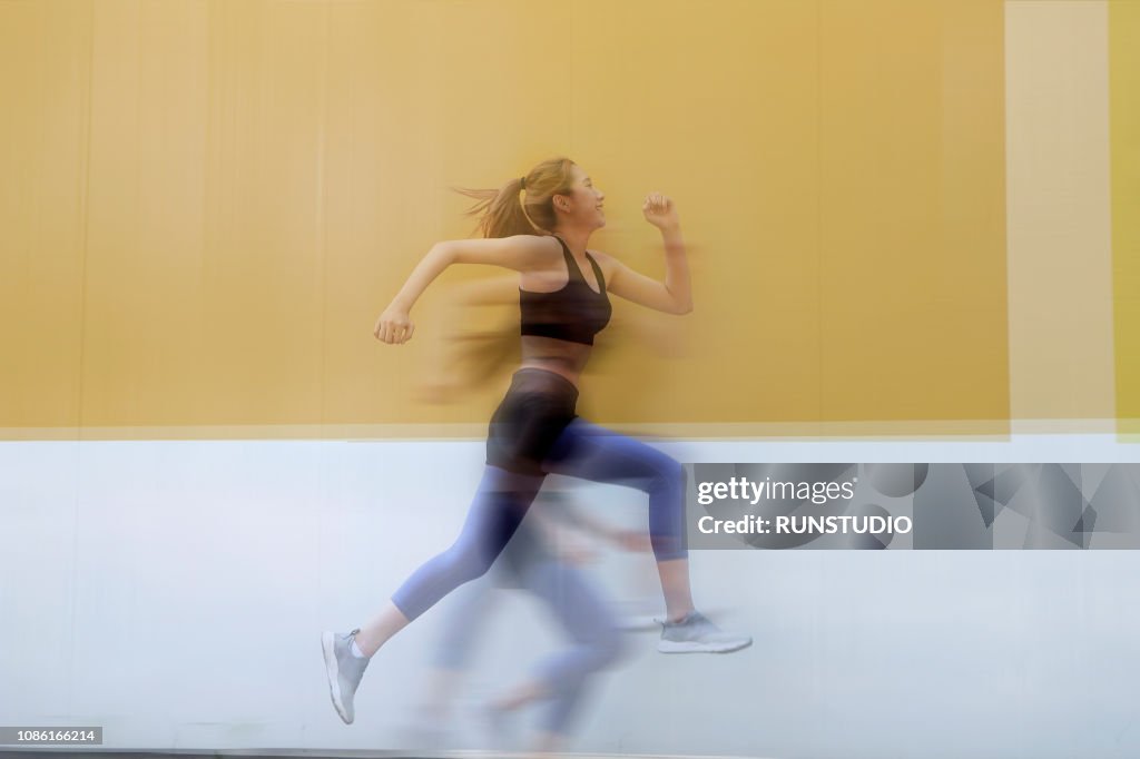Multiple exposure of woman running