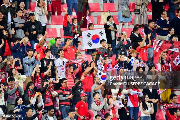 South Korea supporters celebrate their win during the 2019 AFC Asian Cup Round of 16 football match between South Korea and Bahrain at the Rashid...