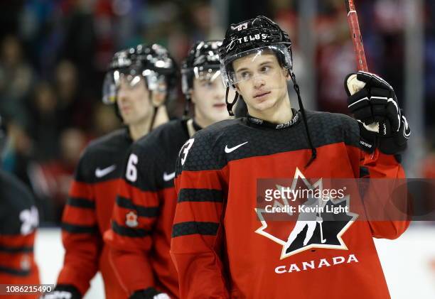 Jack Studnicka of Team Canada raises his stick to salute the fans following a game versus Team Slovakia at the IIHF World Junior Championships at the...