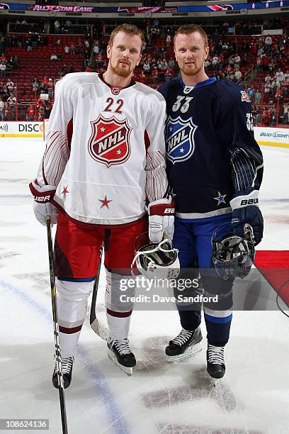 Daniel Sedin of the Vancouver Canucks for team Staal and Henrik Sedin of the Vancouver Canucks for team Lidstrom smile for a photo after the 58th NHL...