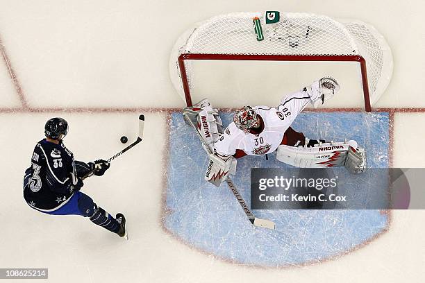 Henrik Sedin of the Vancouver Canucks attempts to score a goal against Cam Ward of the Carolina Hurricanes in the 58th NHL All-Star Game at RBC...