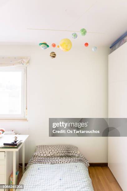 handcrafted solar system mobile in kid room - baby mobile stock pictures, royalty-free photos & images