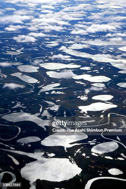 In this aerial image, lakes caused by melt of permafrost soil are seen on July 28, 2006 in Barrow, Alaska.