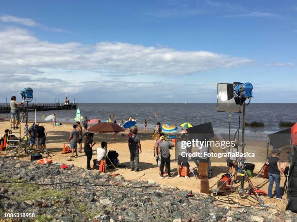 film crew on location shooting advertisement - film crew outside stock pictures, royalty-free photos & images