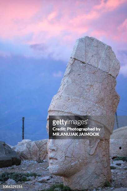 stone head statues at nemrut mountain in turkey - ares god stock pictures, royalty-free photos & images