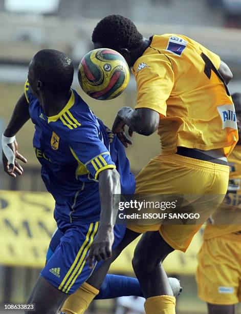 Ivorian ASEC Mimosas player Robert Sankara fights for the ball with Cansado of Mauritania's Mohamed Dema on January 30, 2011 at the Robert Champroux...