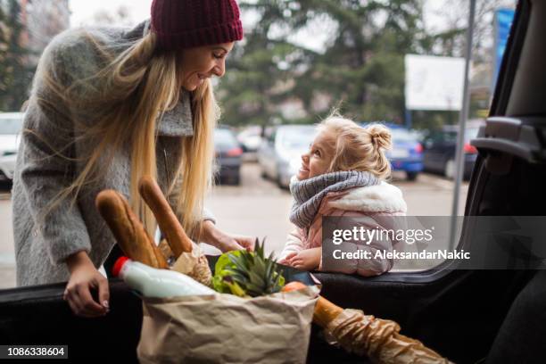 at grocery shopping with mom - shopping bags car boot stock pictures, royalty-free photos & images