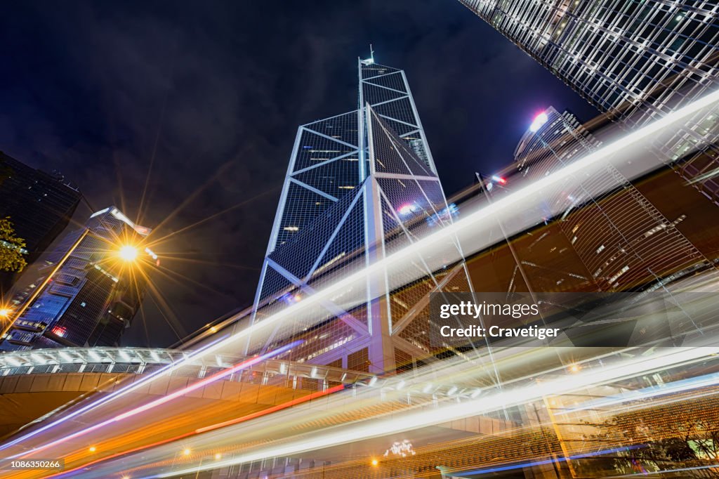 Car trails in downtown at night time of Hong Kong,China.