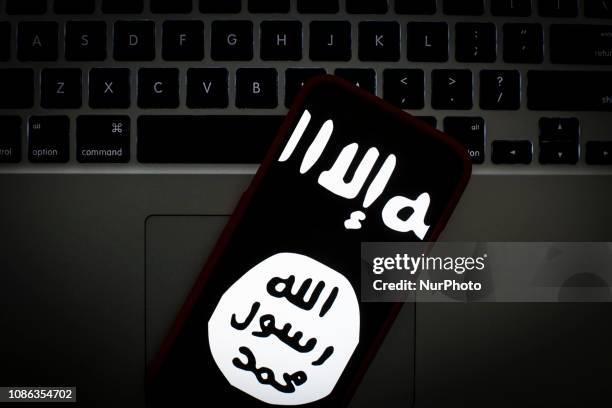 The Islamic State logo is seen on a portable mobile device in this photo illustration on January 22, 2019.