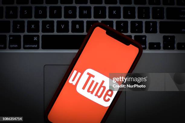 The YouTube logo is seen on a portable mobile device in this photo illustration on January 22, 2019.