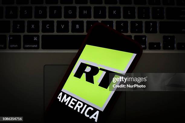 The Russia Today America logo is seen on a portable mobile device in this photo illustration on January 22, 2019.