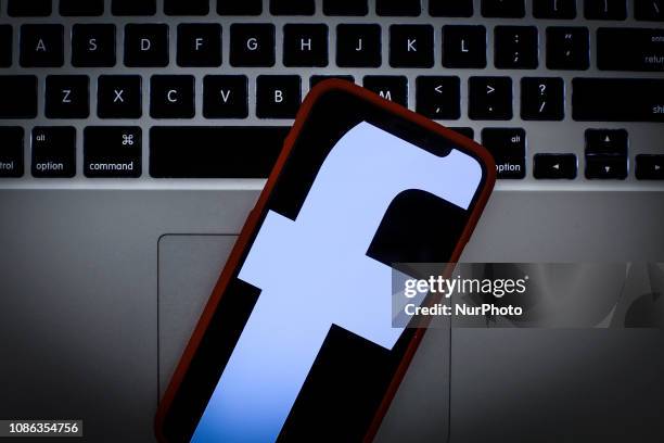 The Facebook logo is seen on a portable mobile device in this photo illustration on January 22, 2019.