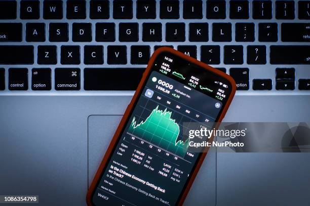 Graph displaying the Alphabet stock price is seen on the Stocks market application in this photo illustration on an Apple iPhone on January 22, 2019.