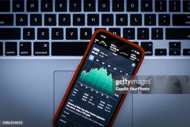 Graph displaying the Nike stock price is seen on the Stocks market application in this photo illustration on an Apple iPhone on January 22, 2019.