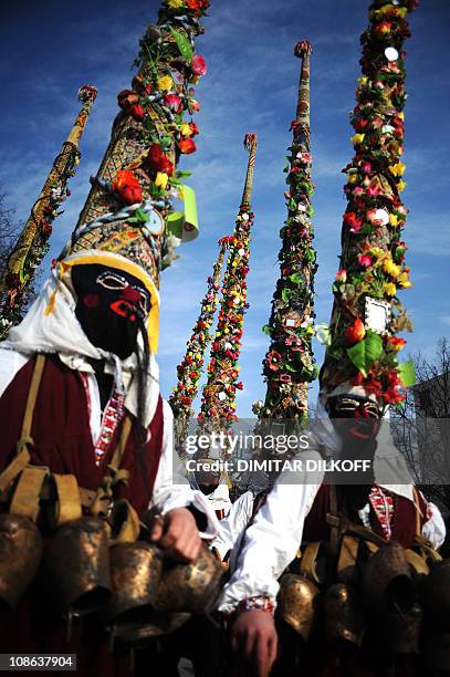 Bulgarian dancers known as a "kukeri" attend a ritual dance during the International Festival of the Masquerade Games in Pernik near the capital...