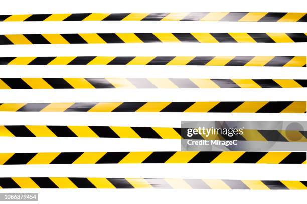 yellow and black striped cordon tape - tape foto e immagini stock