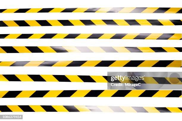 yellow and black striped cordon tape - warning sign white background stock pictures, royalty-free photos & images