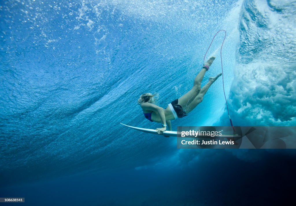 Female Pro surfer at Cloud Break Fiji