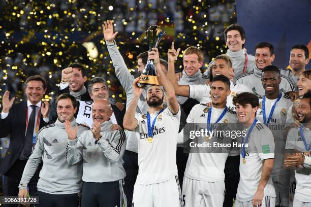 Players of Real Madrid celebrate with the trophy after the FIFA Club World Cup UAE 2018 Final between Real Madrid and Al Ain at the Zayed Sports City...