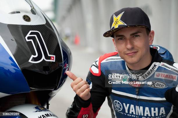 Jorge Lorenzo of Spain and Yamaha Factory Racing poses near the new number 1 on his bike in front of box in Sepang Circuit on January 31, 2011 in...