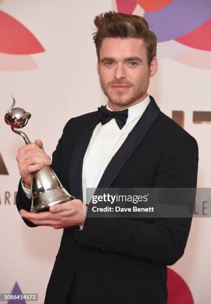 Richard Madden, winner of the Best Drama Performance award for "Bodyguard", poses in the Winners Room during the National Television Awards held at...