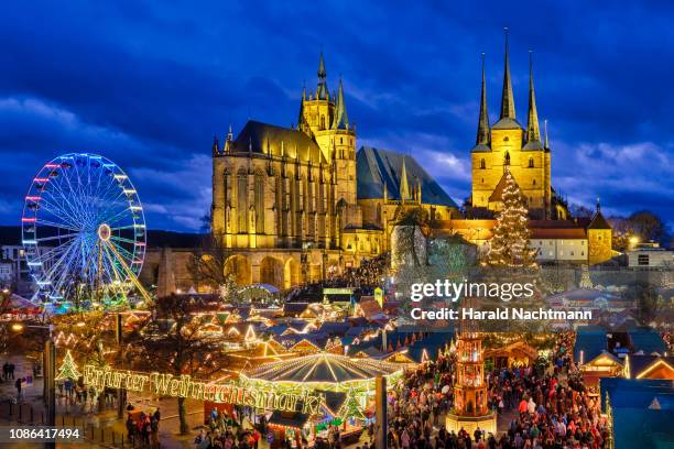 view to lighted christmas market at old town square, erfurt, thuringia, germany - germany christmas stock pictures, royalty-free photos & images